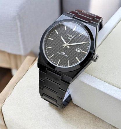 Black Tissot PRX Powermatic 80 wristwatch with stainless steel bracelet on white background