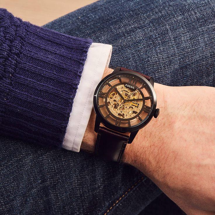 Man wearing Fossil skeleton automatic watch with leather strap and visible gears